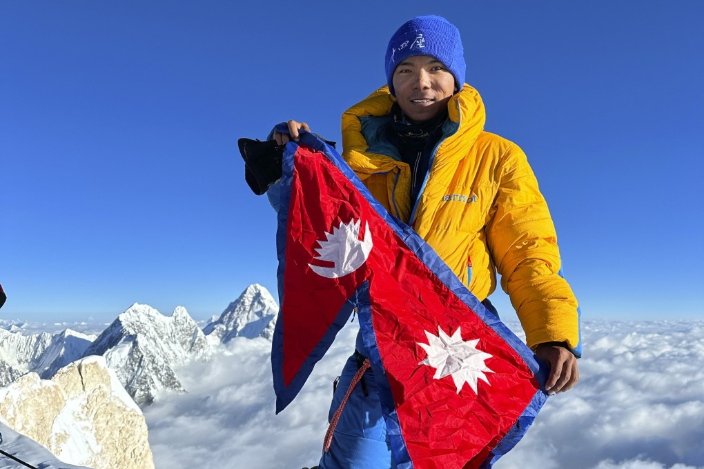 Nima Rinji Sherpa pictured on top of G2 mountain in Pakistan in July last year. Photo: AP