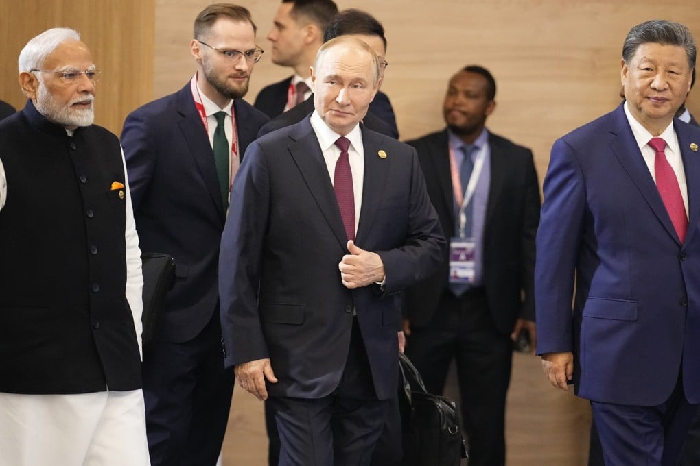 (From left) Indian Prime Minister Narendra Modi, Russian President Vladimir Putin and Chinese President Xi Jinping attend a family photo ceremony prior to the BRICS Summit plenary session in Kazan, Russia, October 23, 2024. Photo: AP