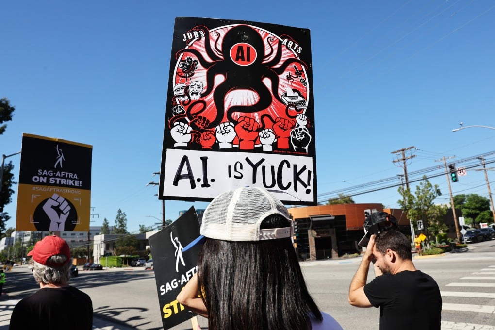 A sign refers to people’s distrust of AI as striking SAG-AFTRA members and supporters picket outside Disney Studios in October 2023, in Burbank, California. Artificial intelligence is not yet being used to help make movies in Hollywood. Photo: Getty Images