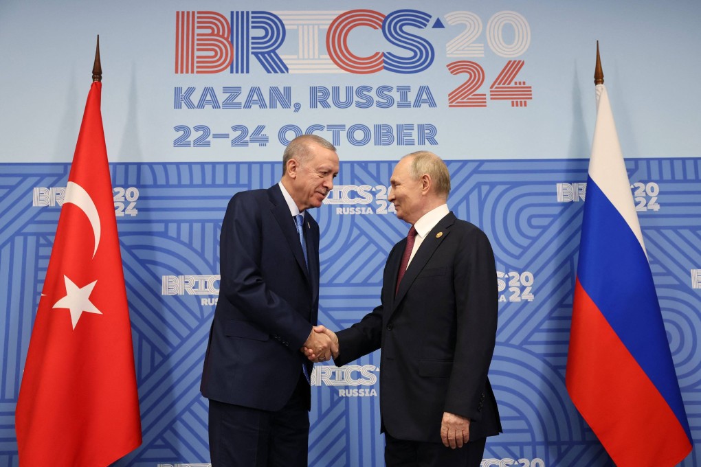 Turkey’s President Recep Tayyip Erdogan (left) shakes hands with Russia’s Vladimir Putin on the sidelines of the Brics summit in Kazan on Wednesday. Photo: Turkish Presidency Press Office / AFP
