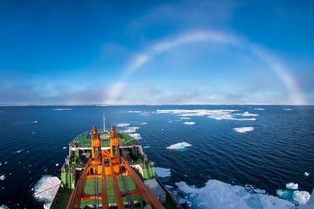 A research ship passes a white rainbow in the ice-strewn East-Siberian Sea off the Arctic Ocean. Photo: Shutterstock