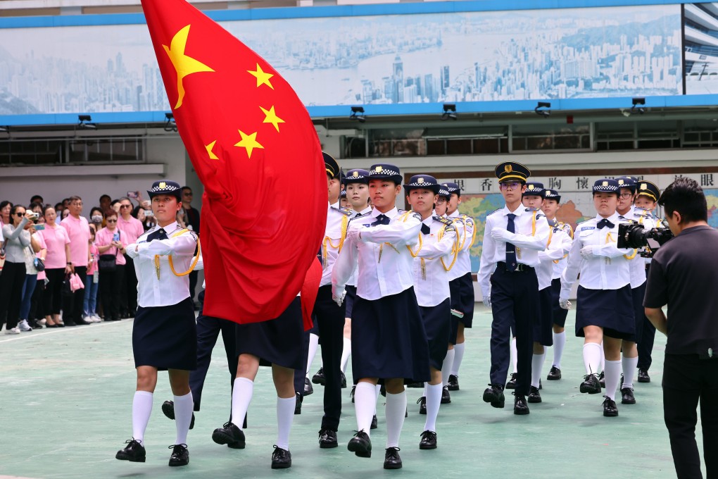 Young people participate in a flag-raising ceremony in Sha Tin. Photo: Dickson Lee