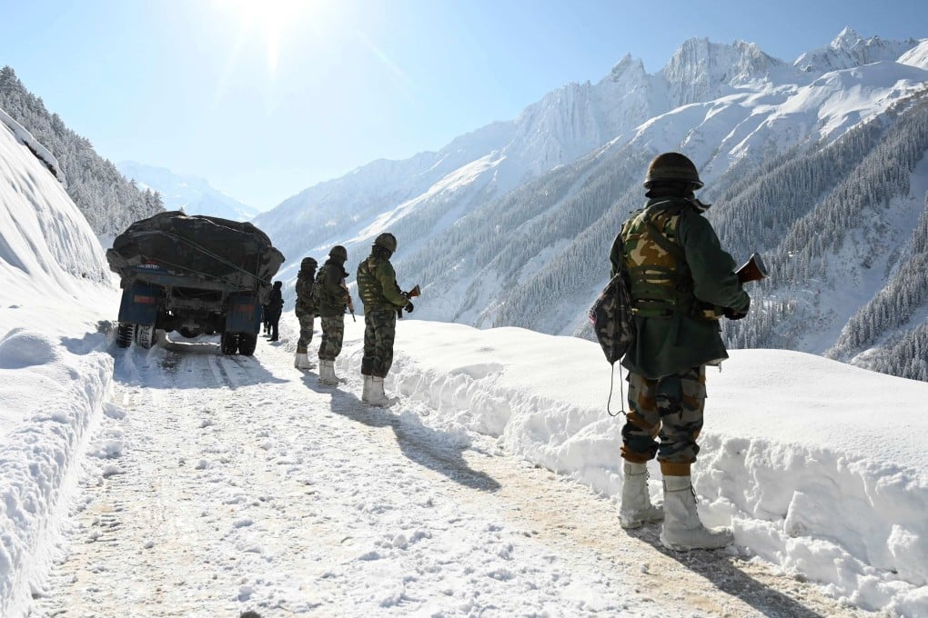 Indian army soldiers are seen on a road bordering China in February 2021. Photo: AFP