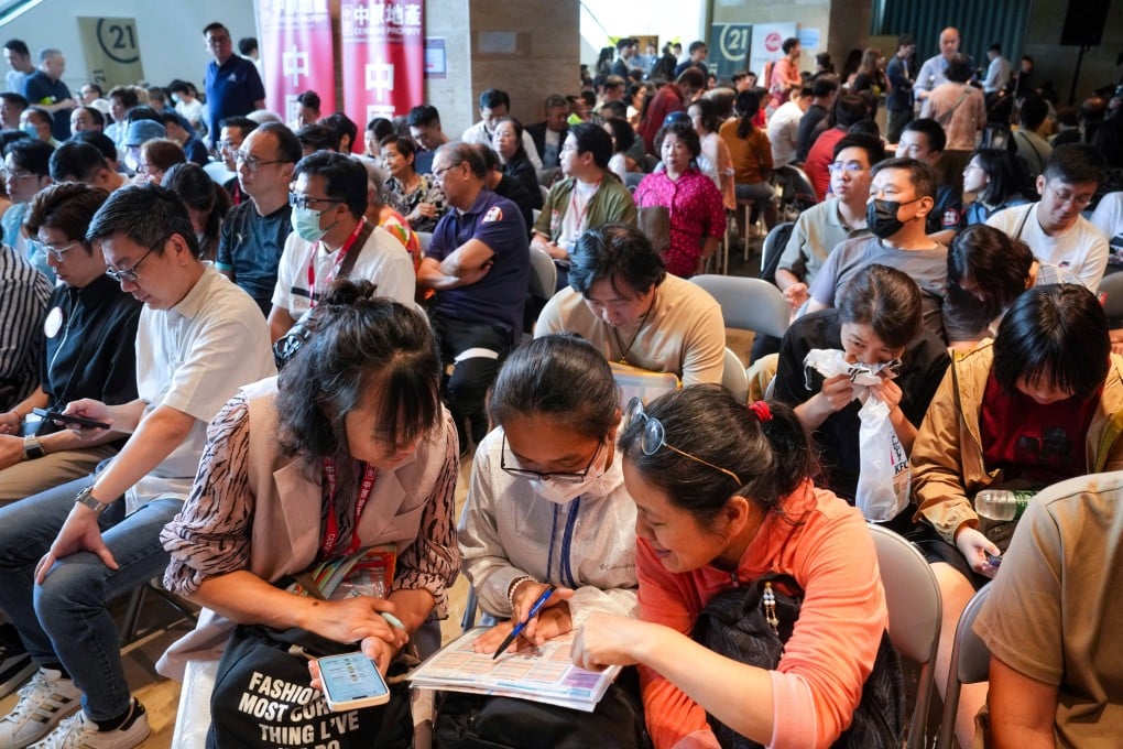 Property agents and buyers gather at Chinachem’s sales office for a chance to buy flats in Echo House on Sunday. Photo: Elson Li