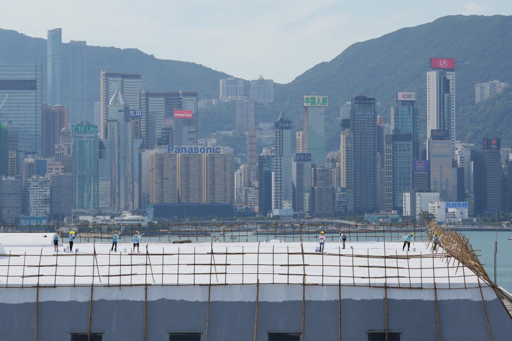 Worker carrying out essential maintenance on the rooftop of the Hong Kong Coliseum in Hung Hom on October 24. Photo: May Tse
