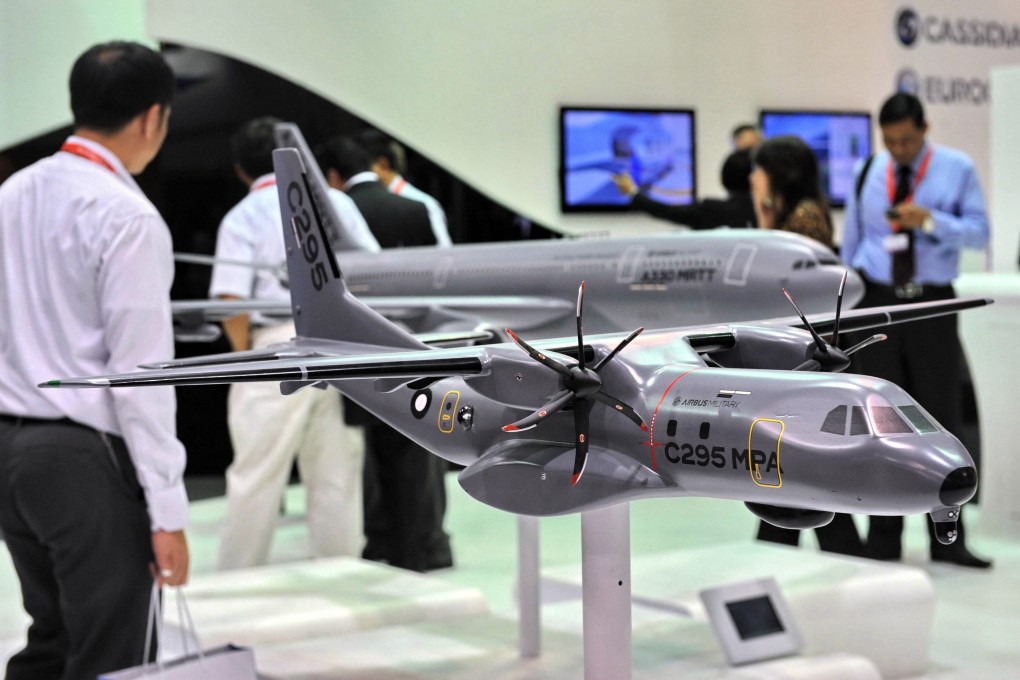 A model of an Airbus C-295 military transport plane is exhibited at the Singapore Airshow in 2012. Photo: AFP