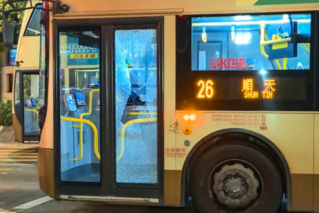 A passenger has shattered the glass panelling of a KMB bus door in a fit of rage after the driver failed to pick him up at a bus stop. Photo: i-Cable TV News