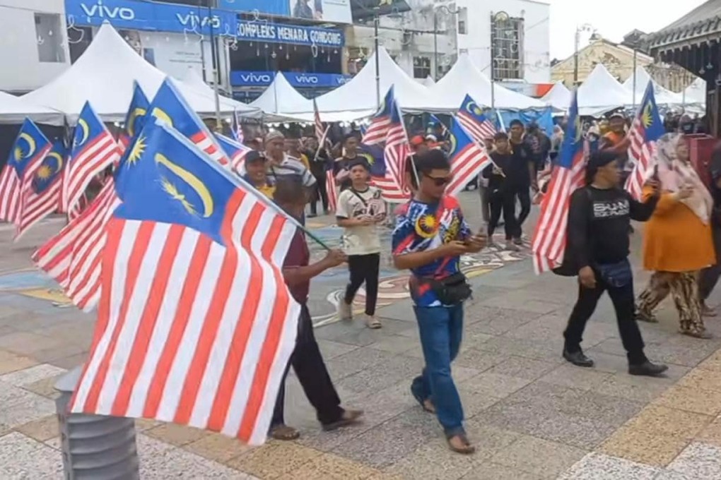 The display of Chinese flags at a cultural festival in Perak on Thursday led to a counter rally on Saturday in which hundreds converged on Teluk Intan’s town square to wave Malaysian flags and sing the national anthem. Photo: TikTok / wanwadifa