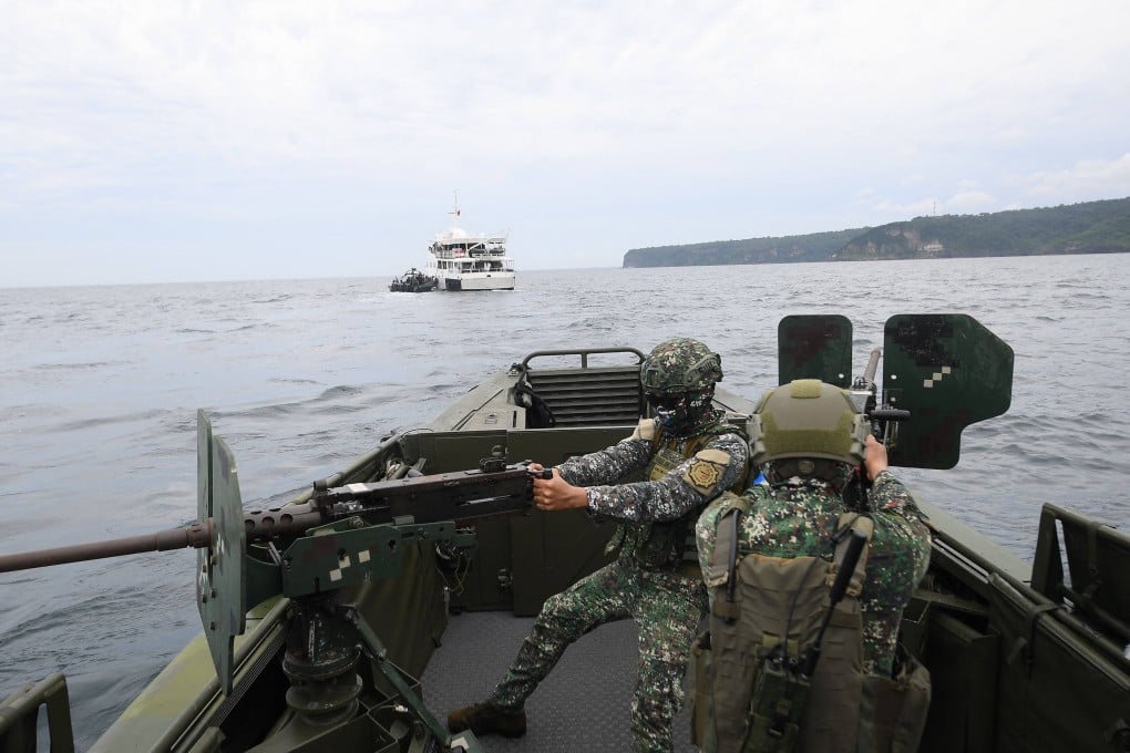 Philippine marines aboard their patrol boat man machine guns during a joint exercise with their US and South Korean counterparts in Cavite province west of Manila on Tuesday. Photo: AFP