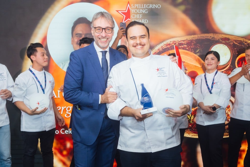Ardy Ferguson (centre, with award), winner of the S.Pellegrino Young Chef Academy Competition 2024-25 Asia Regional Final, poses with San Pellegrino’s Roberto Caroni and other finalists in Hong Kong on October 28, 2024. Photo: S.Pellegrino Young Chef Academy