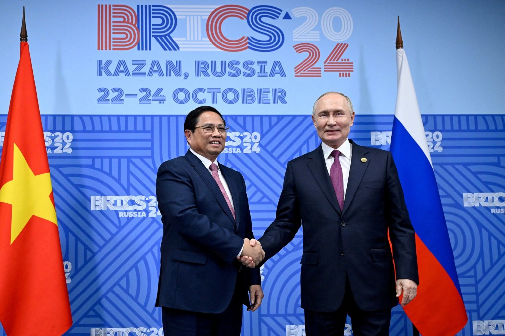 Russian President Vladimir Putin shakes hands with Vietnamese Prime Minister Pham Minh Chinh during their meeting on the sidelines of the Brics summit in Kazan on October 24. Photo: Reuters