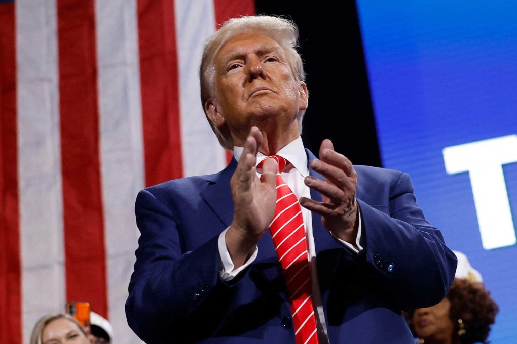 Republican presidential nominee Donald Trump applauds after delivering remarks at a campaign rally on October 15. Photo: Getty Images via AFP
