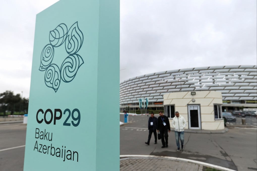People walk near the Baku Olympic Stadium, the venue of the Cop29 UN climate change conference, in Baku, Azerbaijan, on October 18. Photo: Reuters