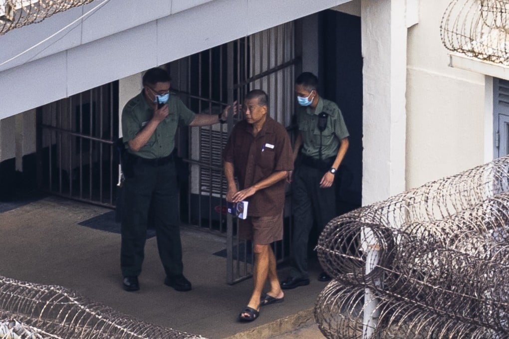 Former tycoon Jimmy Lai is escorted through the grounds of Stanley Prison in July 2023. Photo: Associated Press