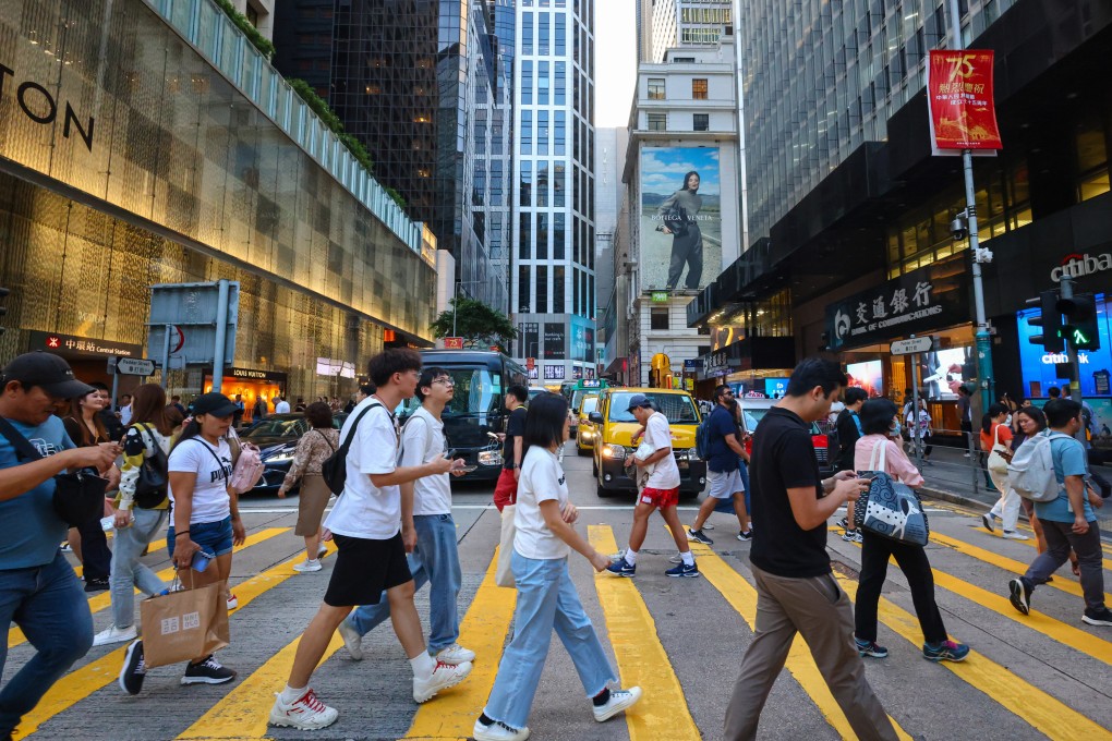 People cross the street in Hong Kong’s financial heart, Central. Photo: Dickson Lee