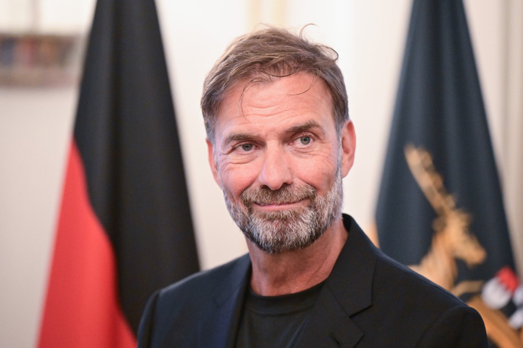 German coach Jurgen Klopp, seen here receiving the Order of Merit of the State of Baden-Wuerttemberg, has defended his decision to take the job as head of global football at drink giants Red Bull. Photo: dpa