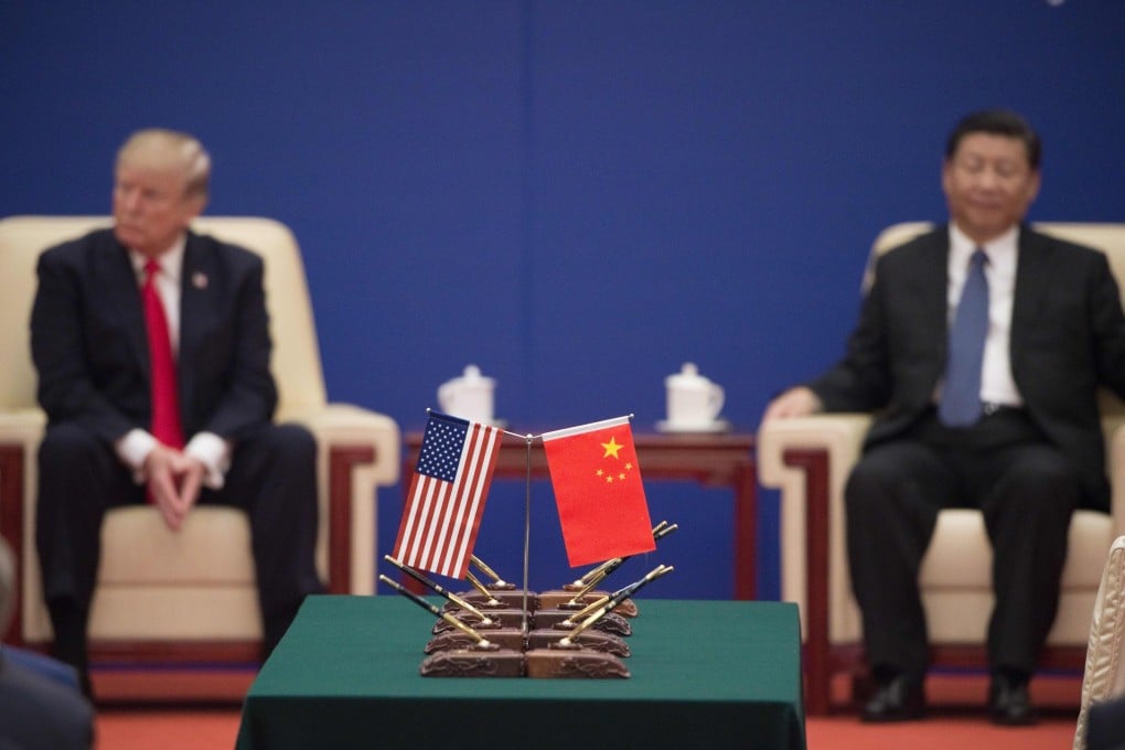 On November 9, 2017, US and Chinese presidents Donald Trump and Xi Jinping attend a business leaders’ event at the Great Hall of the People in Beijing. If re-elected, Trump will erect a Fortress America of trade with new tariffs, weakening middle industrial powers like Germany and Japan and solidifying the centrality of a G2 – China and the US. Photo: AFP