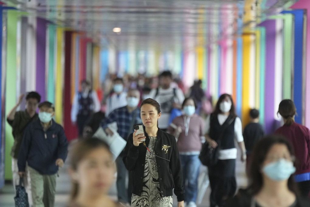 Workers walk during lunch hour in Tsuen Wan on March 21, 2023. Photo: Sam Tsang