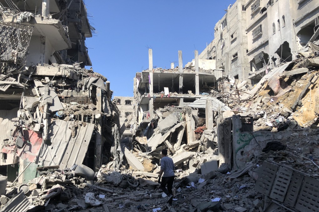 A Palestinian inspects a home after an Israeli air strike in Beit Lahia, northern Gaza. Photo: Khalil Al-Kahlout/Quds Net News via ZUMA Press/dpa