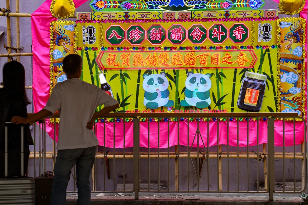 Pat Chun has set up a large signboard outside its Mong Kok store to celebrate the 100th day of the birth of Hong Kong’s panda twins. Photo: Jelly Tse