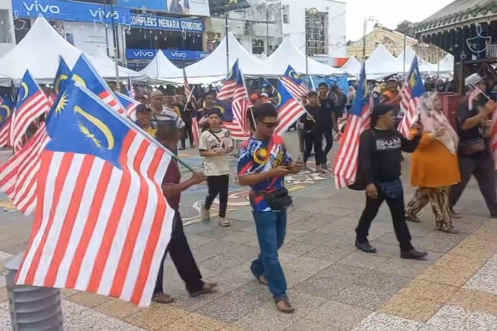 The display of Chinese flags at a cultural festival in Perak led to a counter rally two days later in which hundreds converged on a town square in Perak to wave Malaysian flags and sing the national anthem. Photo: TikTok / wanwadifa