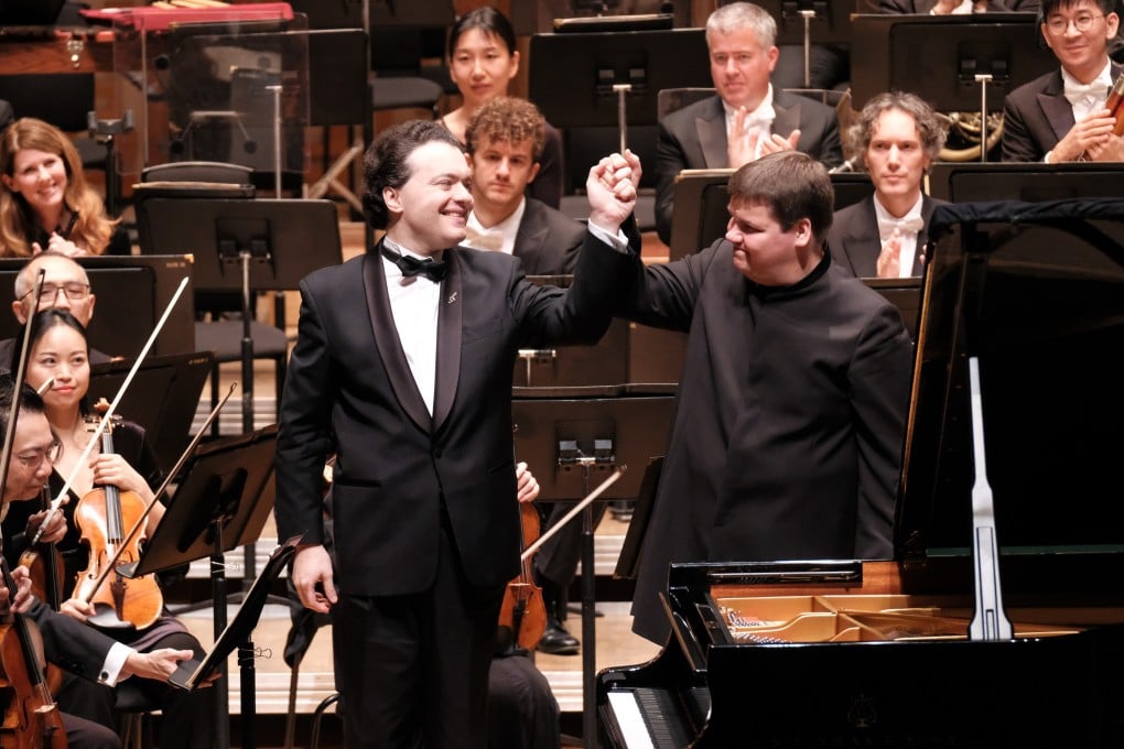 Evgeny Kissin and conductor Andris Poga receive the applause of the audience in 2018 after a performance by the Russian-born pianist with the Hong Kong Philharmonic. After being named a “foreign agent” by Moscow over his support for Ukraine, Kissin cancelled his November 2024 recital in Hong Kong. Photo: Ka Lam/HKPhil