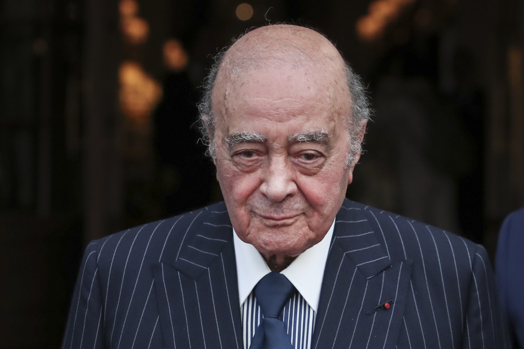 Egyptian businessman and Ritz hotel owner Mohammed Al Fayed poses with his hotel staff in Paris, in June 2016. Photo: AP