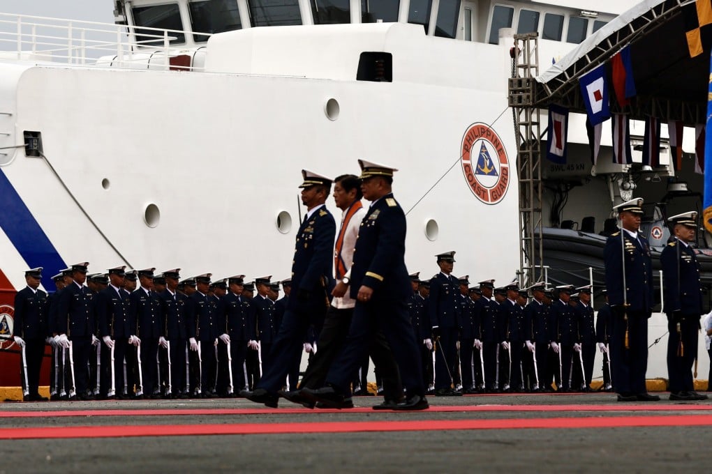 Philippine President Ferdinand Marcos Jnr reviews coastguard personnel next to the patrol ship BRP Gabriela Silang on October 22. Photo: EPA-EFE