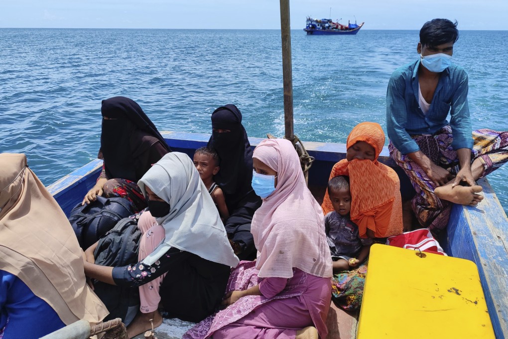 Rohingya Muslims sit in a rescue boat as they are transferred to land from their boat that has been anchored in the waters off Labuan Haji, Aceh province, Indonesia, on October 24. Photo: AP/File