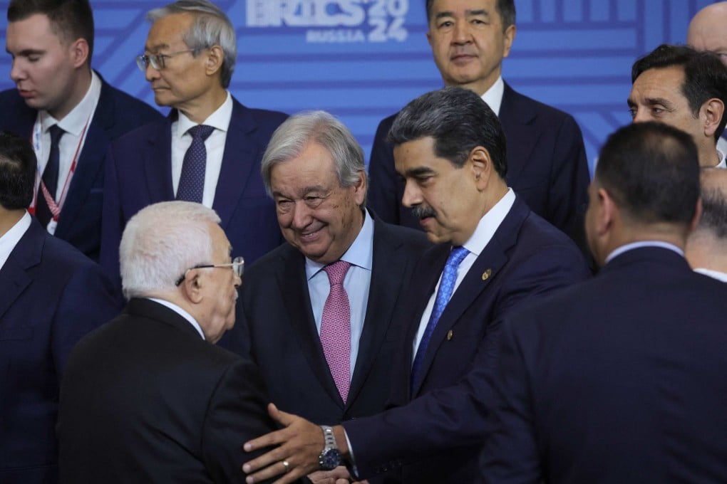 Palestinian Authority president Mahmoud Abbas (centre left) speaks with United Nations secretary general Antonio Guterres (centre) and Venezuelan President Nicolas Maduro (centre right) as participants in the Brics Plus meeting pose for a family photo during the Brics summit in Kazan on October 24. Photo: AFP