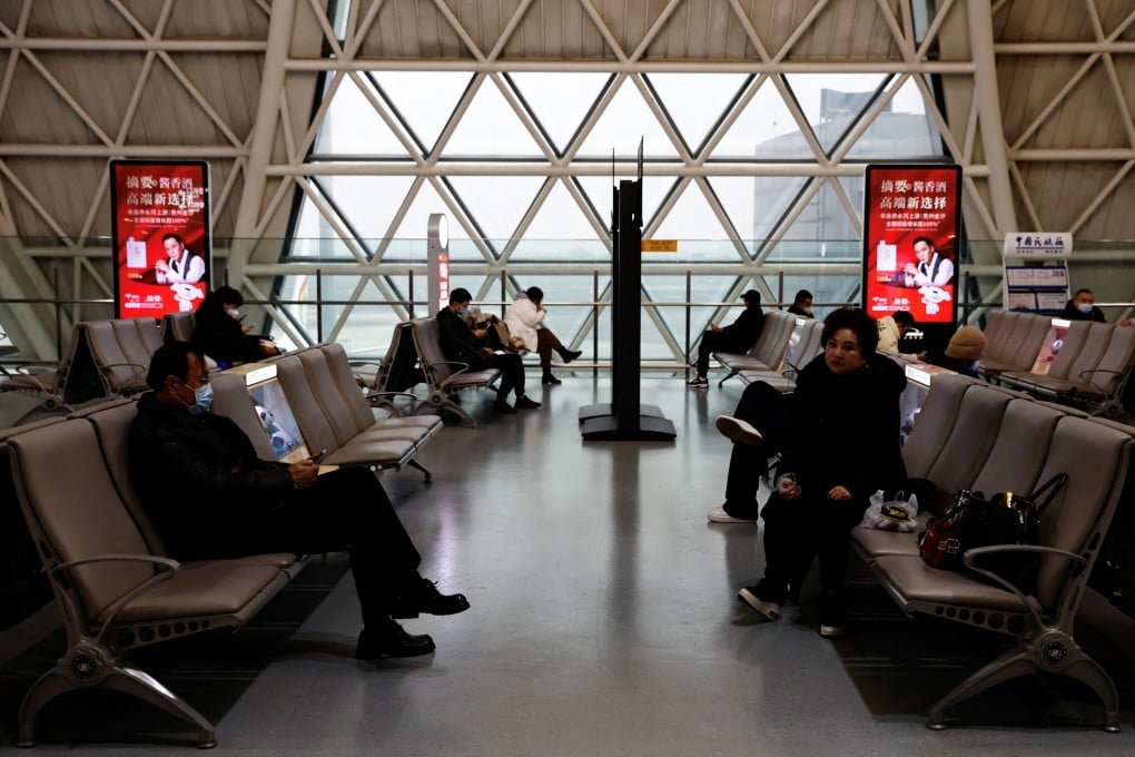 Travellers waited to board a plane at an airport in Chengdu, China. Photo: Reuters