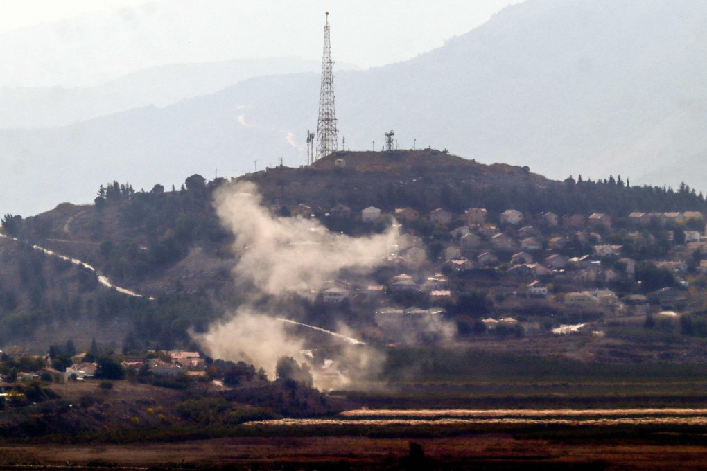 Smoke billows from the site of a rocket attack from Lebanon, in Israeli town of Metula on Thursday. Photo: AFP