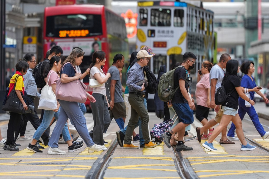 People cross the street in Central. Photo: Eugene Lee