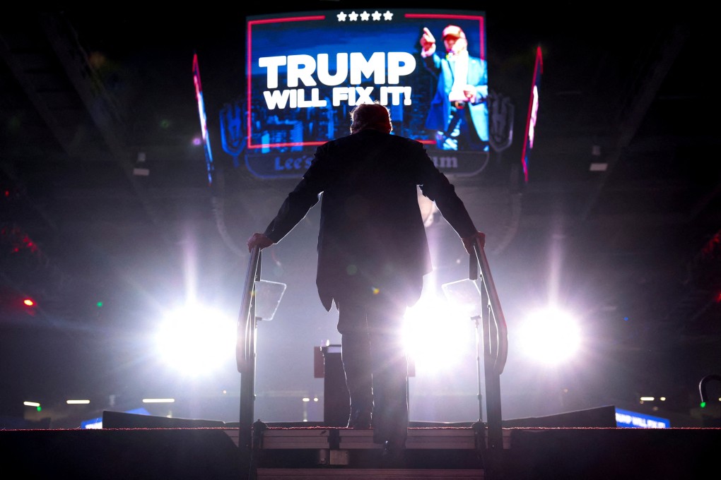 Donald Trump gets on stage to deliver remarks during a rally at in Henderson, Nevada. Photo: Reuters