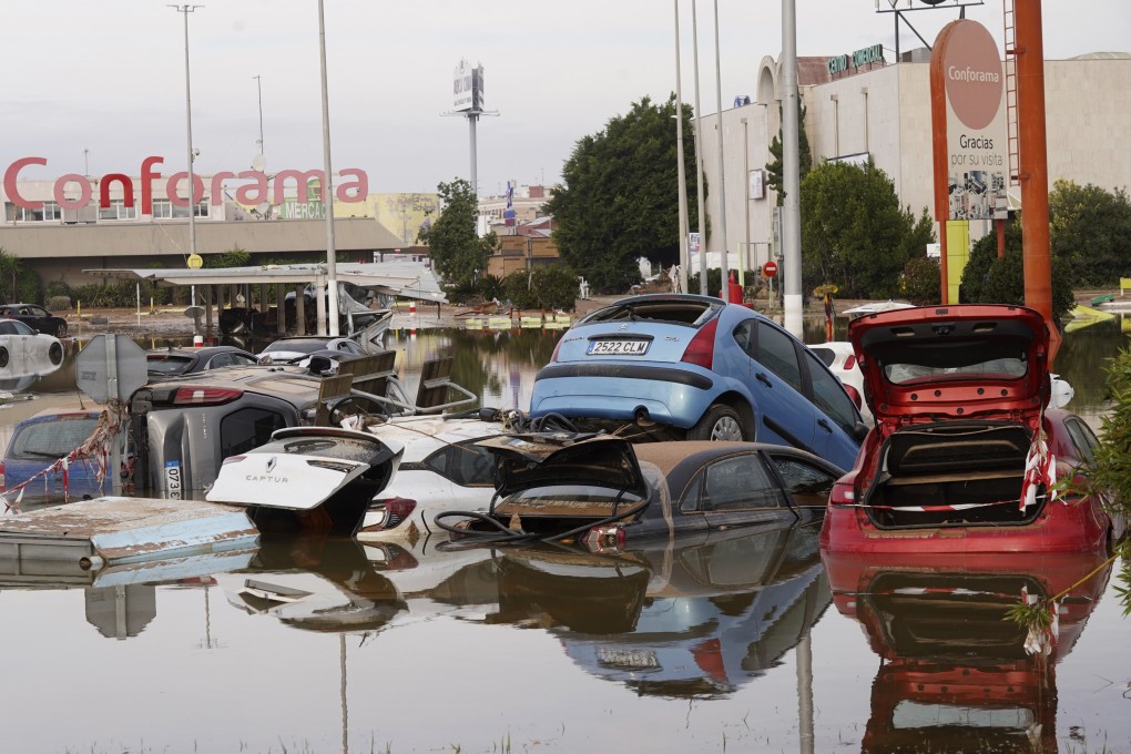Cars are seen half submerged after floods in Valencia, Spain on November 1. Photo: AP