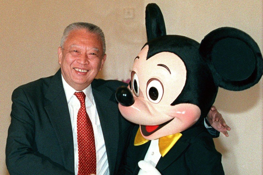 Hong Kong’s then-chief executive Tung Chee-hwa shakes hand with Mickey Mouse at Government House in 1999. Photo: SCMP