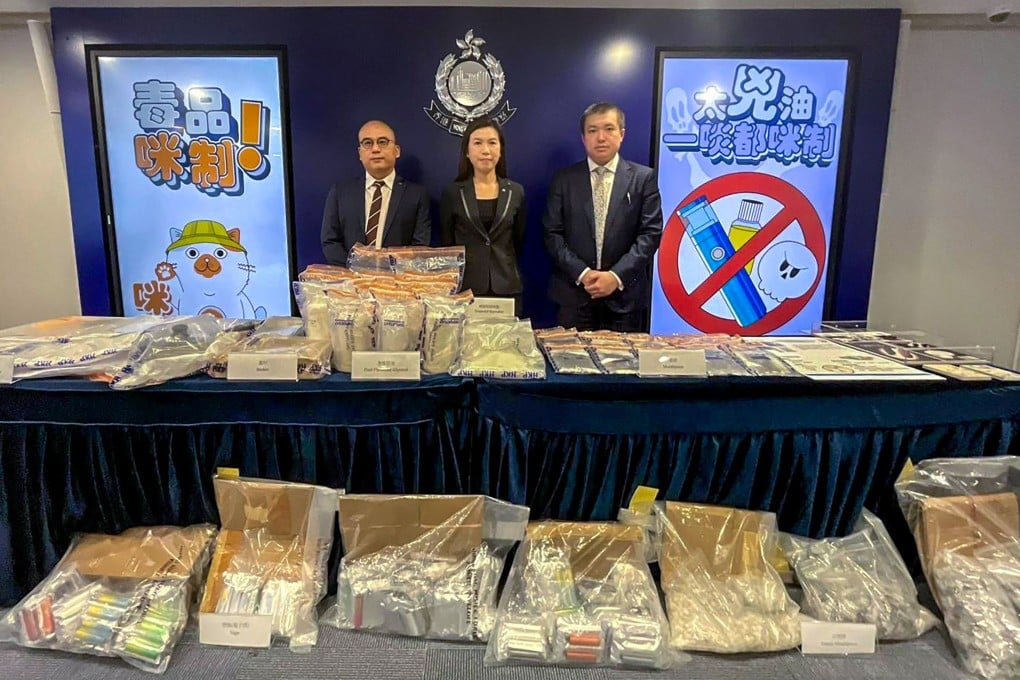 (From left) Narcotics bureau Acting Superintendent Charm Yiu-kwong, bureau Chief Superintendent Ng Wing-sze and Toxicology Reference Laboratory consultant Dr Chong Yeow-kuan with evidence seized in the latest “space oil” arrest. Photo: Handout