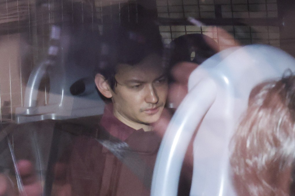 British businessman Jamie Tzewee Chapman is escorted to Eastern Court on Friday. Photo: Nora Tam