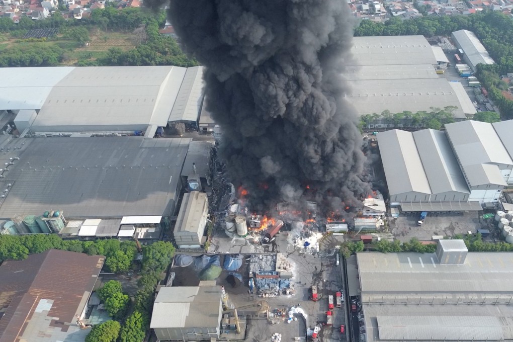 Smoke and flames at a cooking oil factory, in Bekasi, West Java province, Indonesia. Photo: Ilham Apriyanto via Reuters