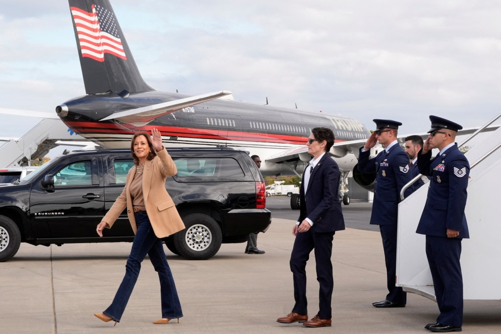 Democratic US presidential nominee Kamala Harris arrives at the airport in Charlotte, North Carolina, on Saturday, with rival candidate Donald Trump’s plane in the background. Photo: Reuters