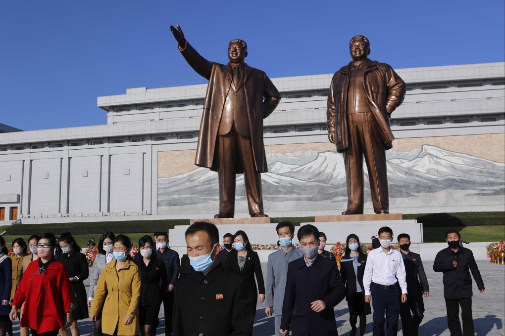 People visit the Mansu Hill to lay flowers to the bronze statues of former North Korean leaders Kim Il-sung and Kim Jong-il in Pyongyang. File photo: AP