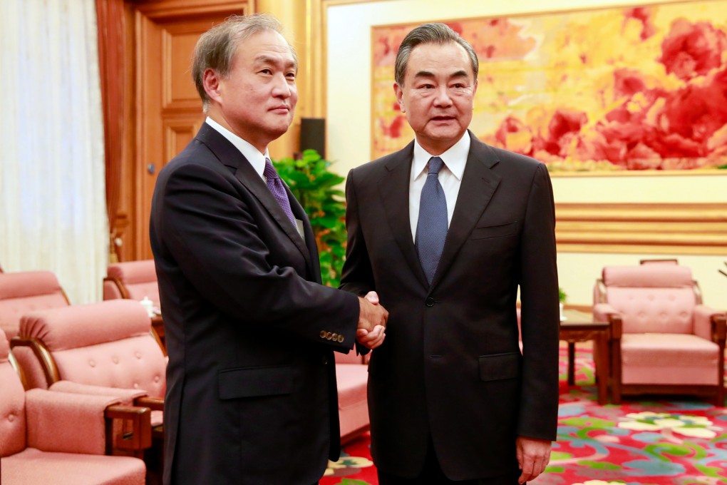 Takeo Akiba of Japan, left, and Chinese Foreign Minister Wang Yi, pictured in 2018, spoke in Beijing on Monday, in a meeting expected to clear the way for a a summit between the two countries’ leaders. Photo: AP