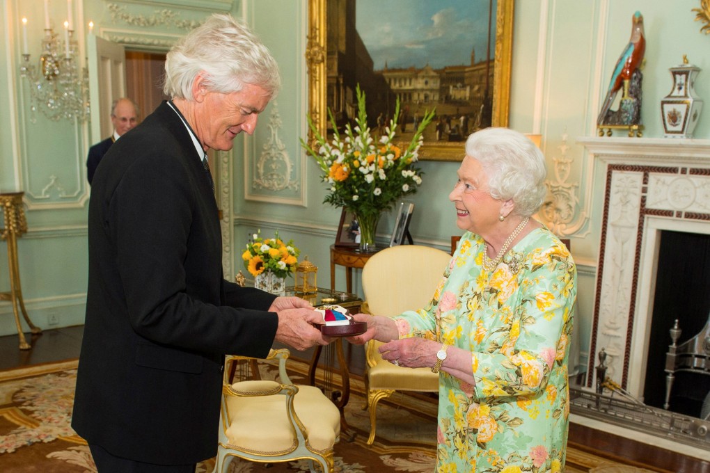 Britain’s Queen Elizabeth presents businessman James Dyson with the insignia of members of the Order of Merit during a private audience at London’s Buckingham Palace in 2016. Photo: Reuters