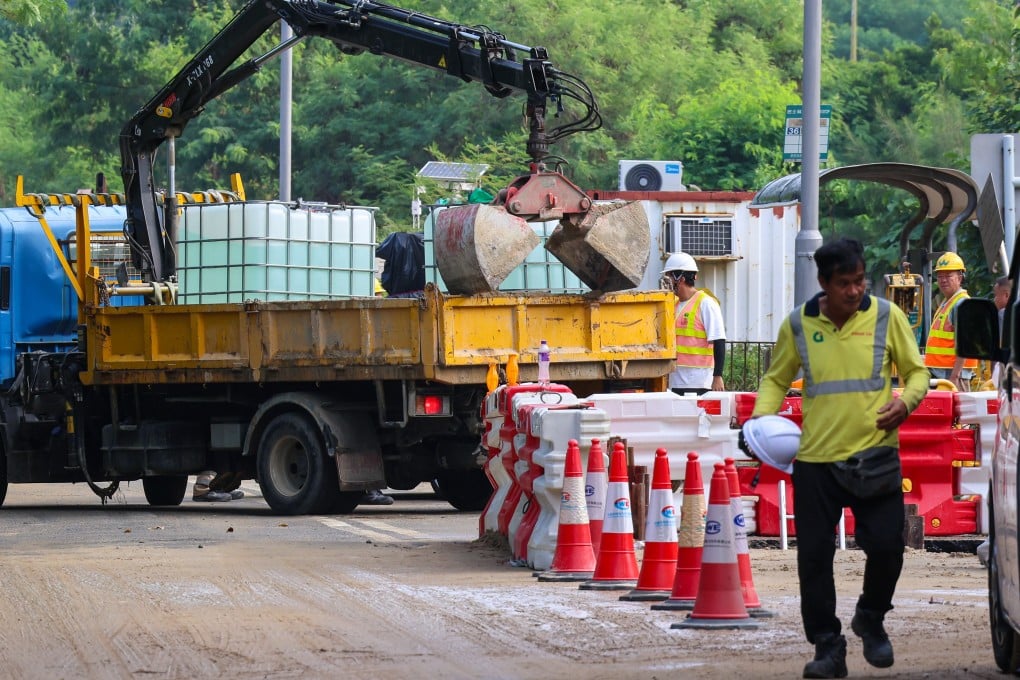 Workers were earlier left racing to fix a burst pipe in Tung Chung that caused a 12-hour water outage. Photo: Jelly Tse