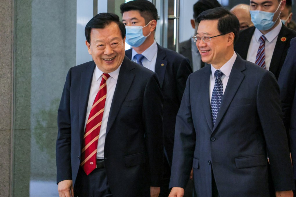 Xia Baolong (left), director of the Hong Kong and Macau Affairs Office, has made the economy a focus in recent meetings with local political and business heavyweights. Photo: Jelly Tse