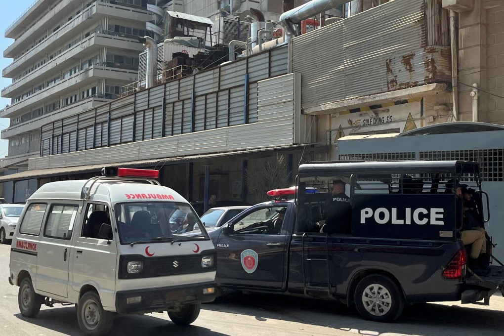 A view of a police mobile and an ambulance outside a factory where, according to police, two Chinese nationals were shot at and injured, in Karachi, Pakistan on November 5. Photo: Reuters