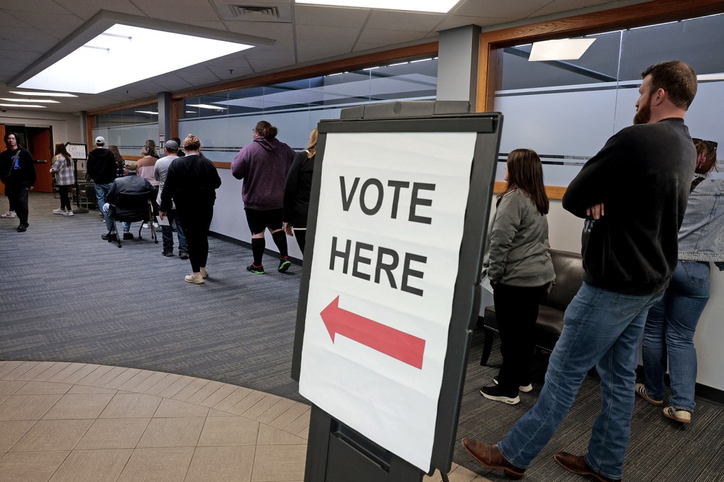 Voters wait in line to cast their ballots in Howell, Michigan, on Sunday, the last day of early voting in the state for the general election. Photo: AFP via Getty Images/TNS