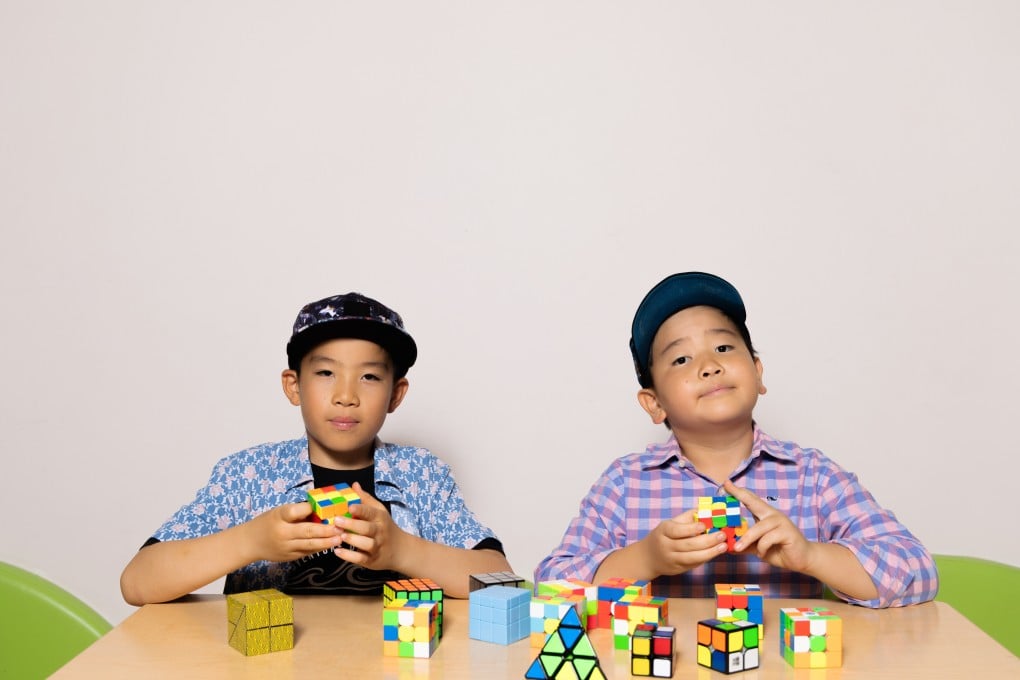 Alexander Choi (right) and Roman Choi (left) with their Rubik’s cubes. Photo: Jocelyn Tam