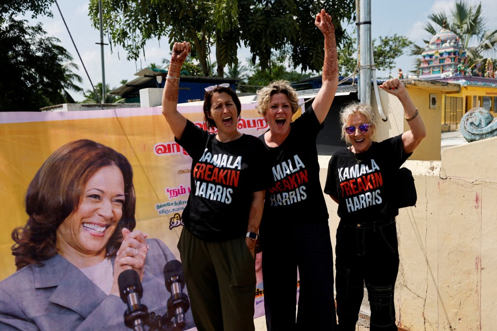 Supporters of Democratic presidential nominee and US Vice President Kamala Harris cheer for her beside a poster in Thulasendrapuram, the village where Harris’ maternal grandfather was born. Photo: Reuters