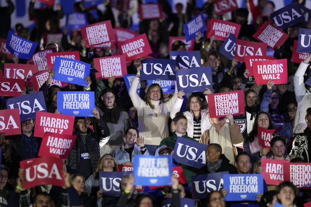 Supporters hold signs at a campaign rally for US presidential candidate Kamala Harris in Philadelphia, Pennsylvania on Monday. Photo: AP